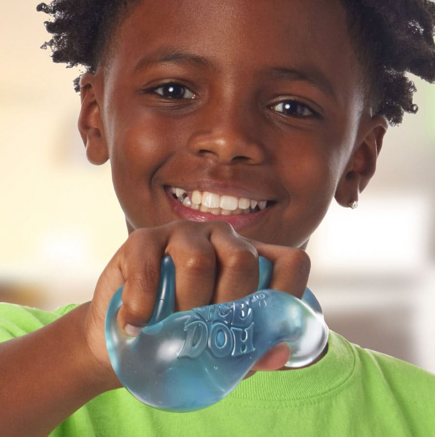 Child squeezing a soft tactile sensory toy