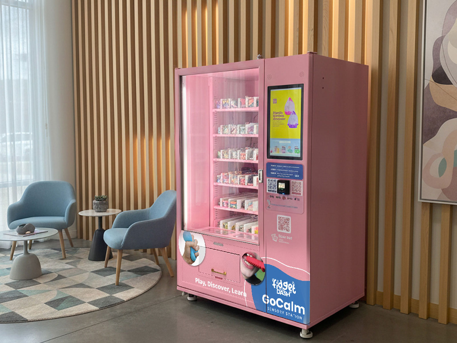 A GoCalm Sensory Support Station installed in a bright, welcoming lobby with comfortable seating